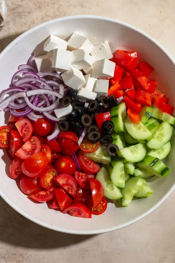 Fresh vegetables, vegan feta, tangy dressing to make Vegan Greek Salad