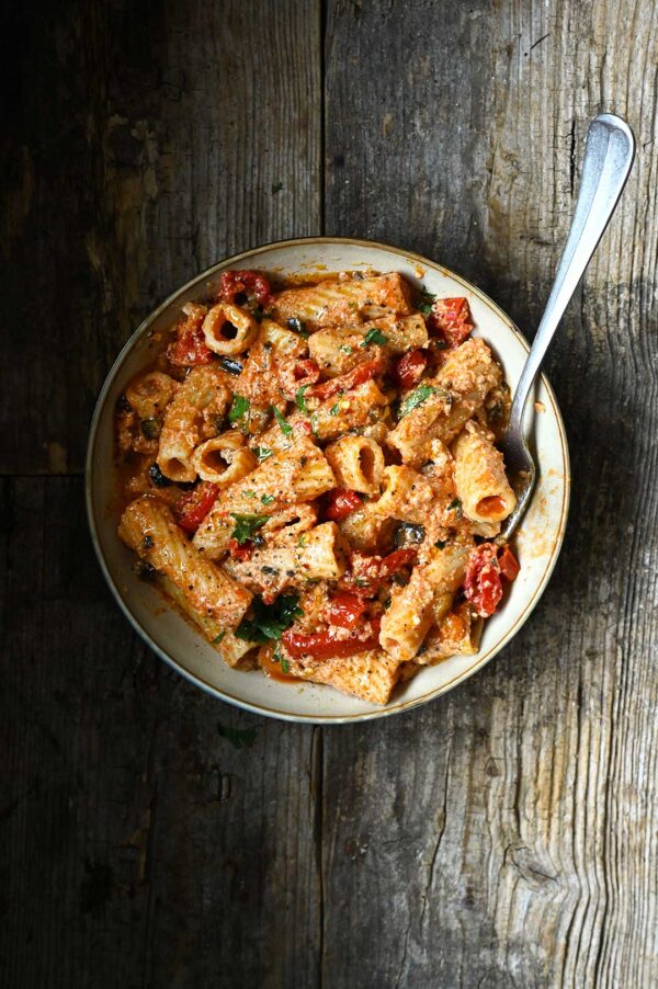 Creamy pasta with ricotta, sun-dried tomatoes, and eggplant in a savory sauce